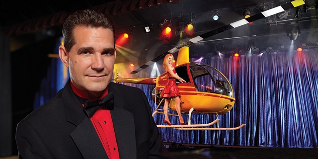 Rick Wilcox and his assistant with a helicopter on stage.