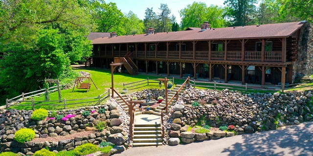 Log cabin resort exterior.