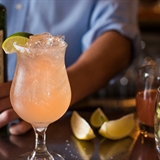 A peach-colored cocktail.