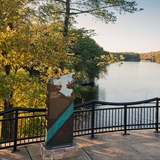 A couple looks out at the Wisconsin River from the Scenic River Walk.