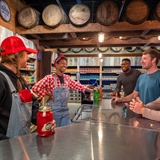 Bartenders talking with customers.