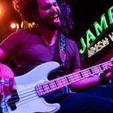 A bass player performing at Showboat Saloon.