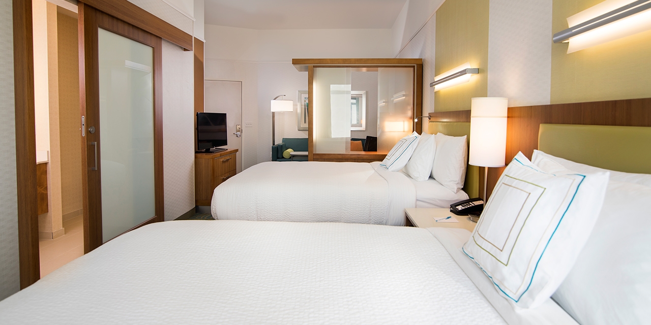 Two bed bedroom with living space and bathroom.