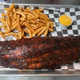 Rack of ribs, french fries, and corn bread.