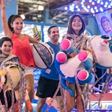 A family enjoys tickets and prizes from the indoor arcade.