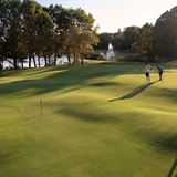Golfers working on their putting skills.