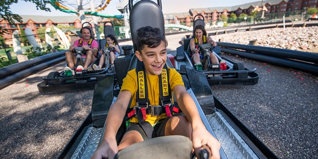 People racing go-carts.
