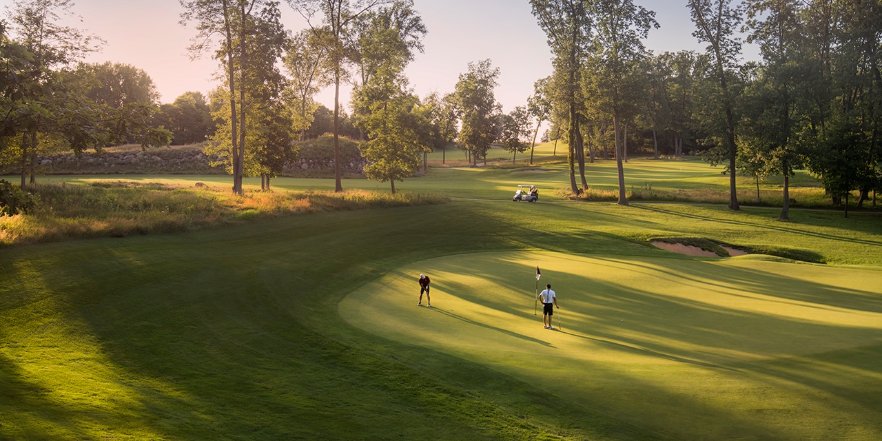 Golfers on the green.
