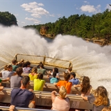 Jet boat making a huge wave.