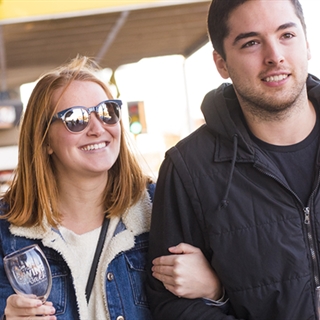 Young couple walking in downtown Wisconsin Dells.