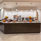 Breakfast area with assorted breakfast items.