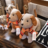 Stuffed animal dogs, a dog pillow, and a cat mug at Winnebago Gift Shop.