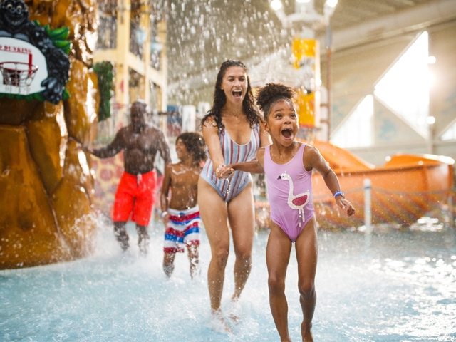 Family playing at Kalahari indoor waterpark.