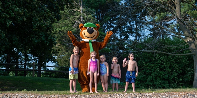 Yogi Bear playing with kids.